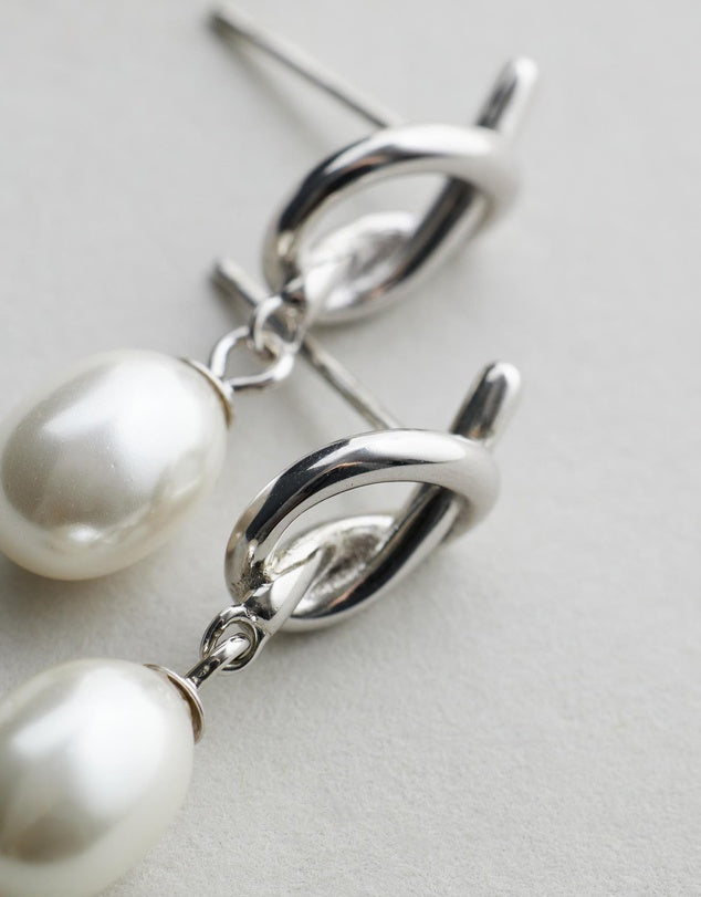 Chloe Pearl Studs - Silver flat lay on grey background
