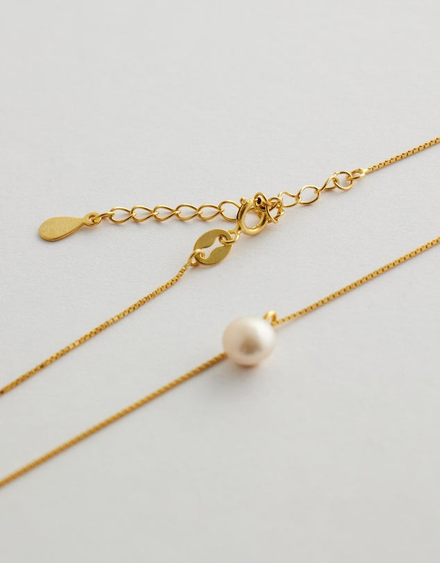 Elowen Pearl Necklace close up flay lay