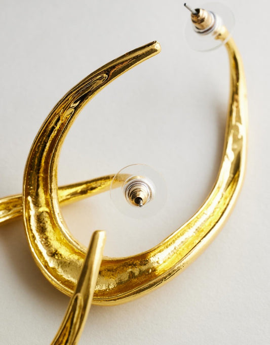 Irregular Hoop Rayne Earrings - Gold on a light gray background