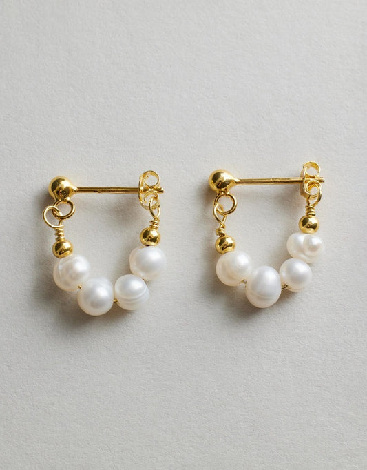 Mickie Pearl Hoop Earrings - Gold close up on a grey background