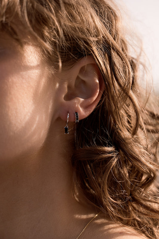 Rita Huggies - Onyx & Silver earrings on womens ear