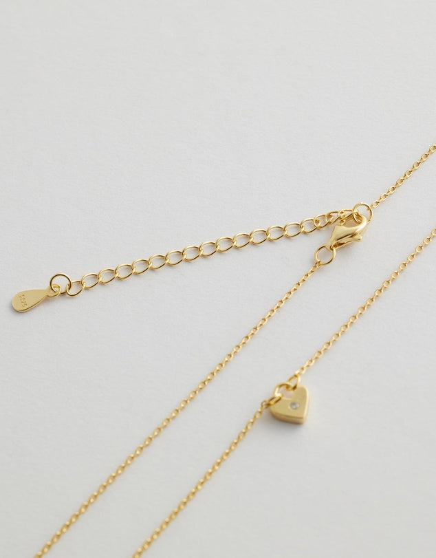 solstice heart necklace close up flay lay clasp