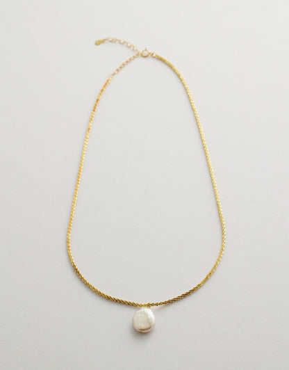 Bellavue Pearl Necklace flay lay, grey background