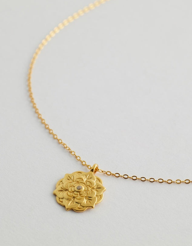 Celestara Mandala Necklace close up pendant flat lay