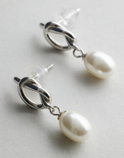 Chloe Pearl Studs - Silver flat lay on grey background