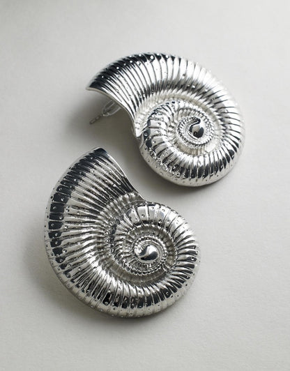 Conch Earrings Silver flat lay front view