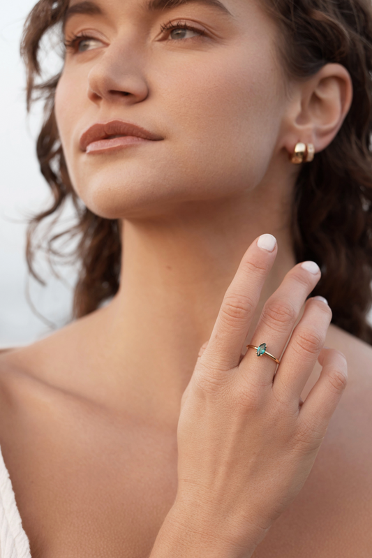 Cuba Emerald Ring - Gold close upon women's hand