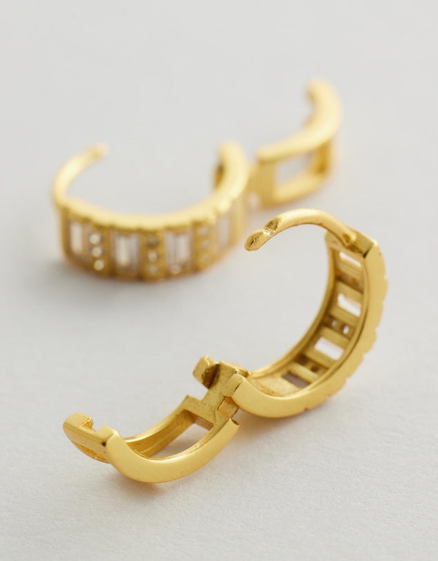 Elysia Diamond Huggie Earrings on a light gray background