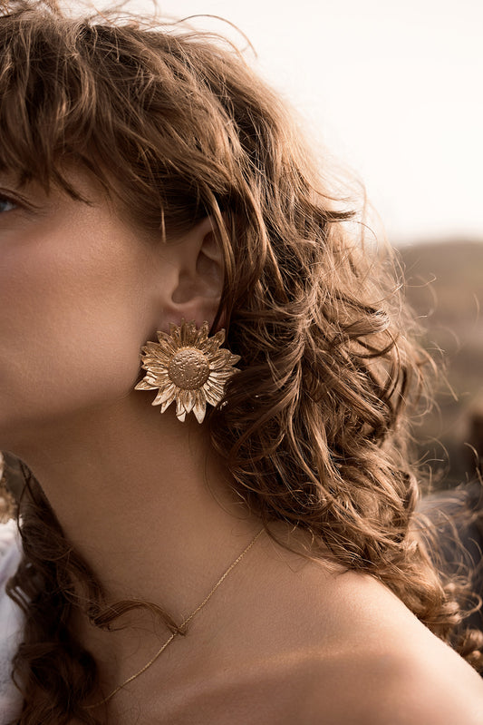 women wearing Follow The Sun Studs - Sunflower Earrings - Gold on ears