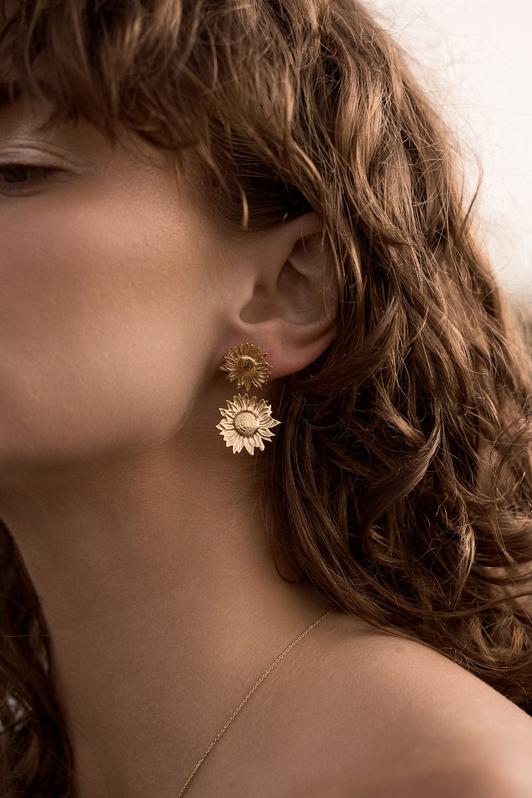 Follow the Sunshine - Sunflower Earrings - Gold on women's ear side profile