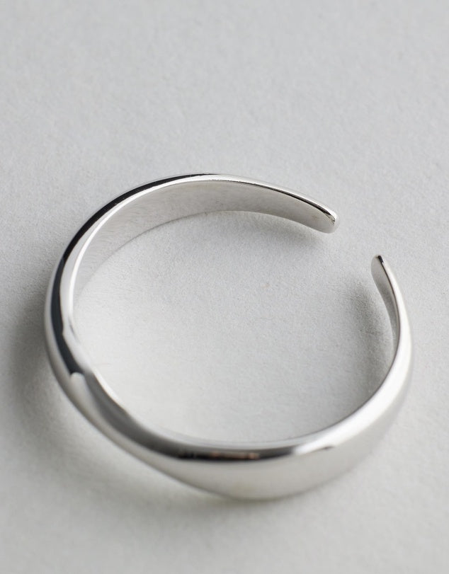 Hannah Wave Ring - Silver open ring on a light gray background