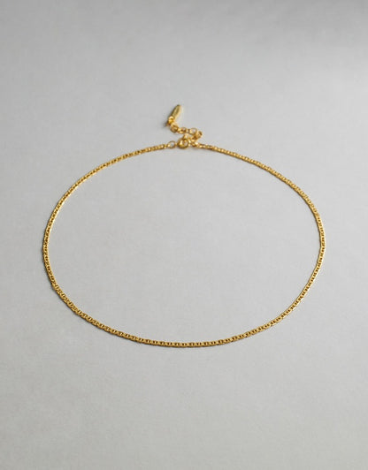Hendrix Boyfriend Chain Gold necklace on a light gray background