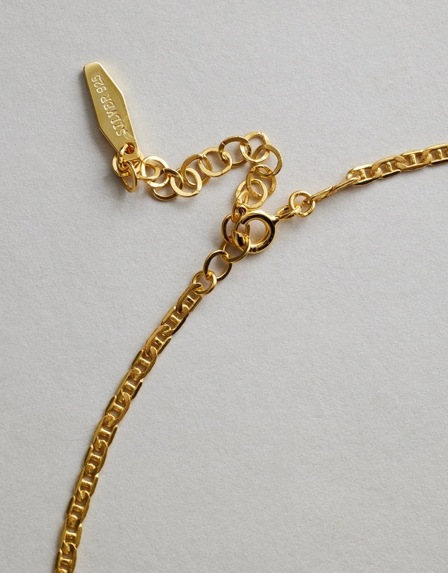 Hendrix Boyfriend Chain Gold chain necklace on a light gray background