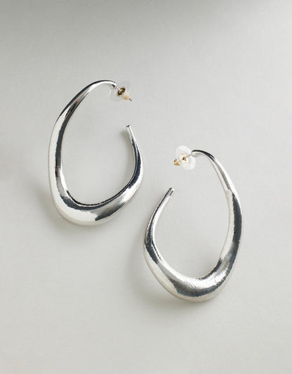 Irregular Hoop Rayne Earrings - Silver on a light gray background