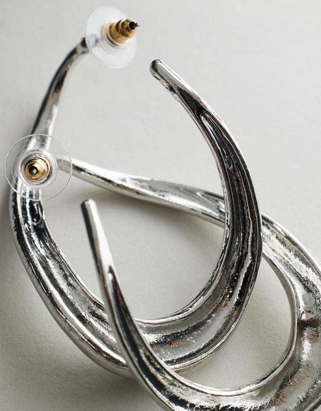 Irregular Hoop Rayne Earrings - Silver on a light gray background