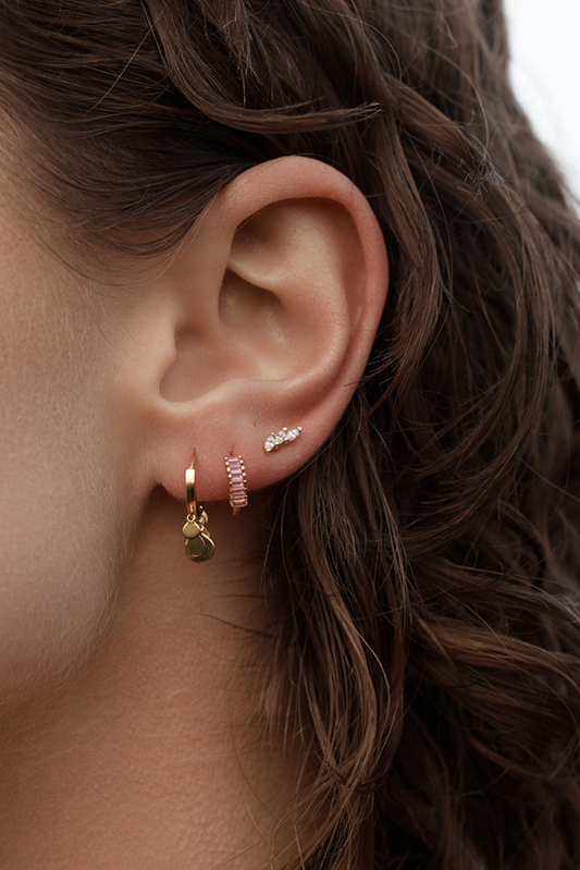 Isla Verde Tassel Hoop Earrings gold on model ears close up