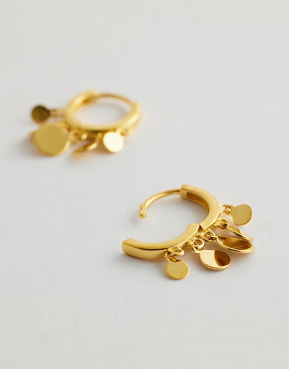 Isla Verde Tassel Hoop Earrings gold flat lay side view