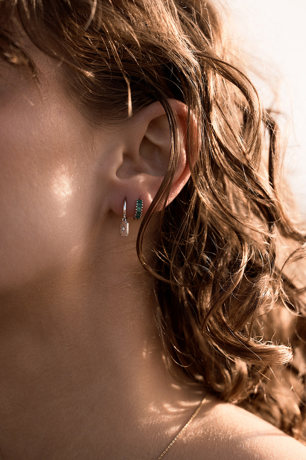 Lennox Huggies - Silver & Green on womens ear