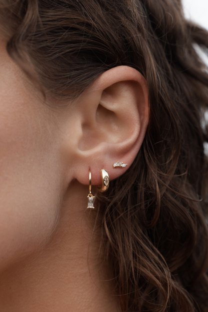 Lunara Hoop Earrings - Gold on model ear styled with earring stack ideas