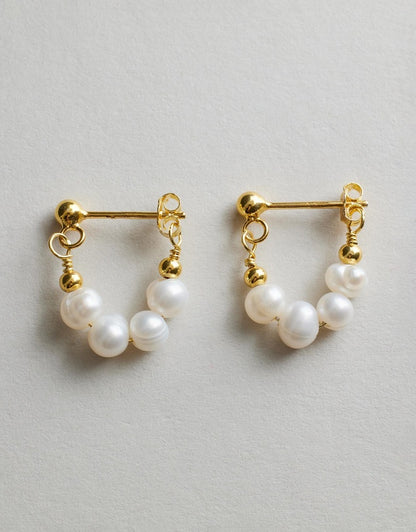 Mickie Pearl Hoop Earrings - Gold close up on a grey background