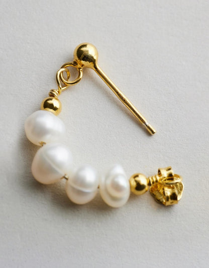 Mickie Pearl Hoop Earrings - Gold close up of one earring on grey background