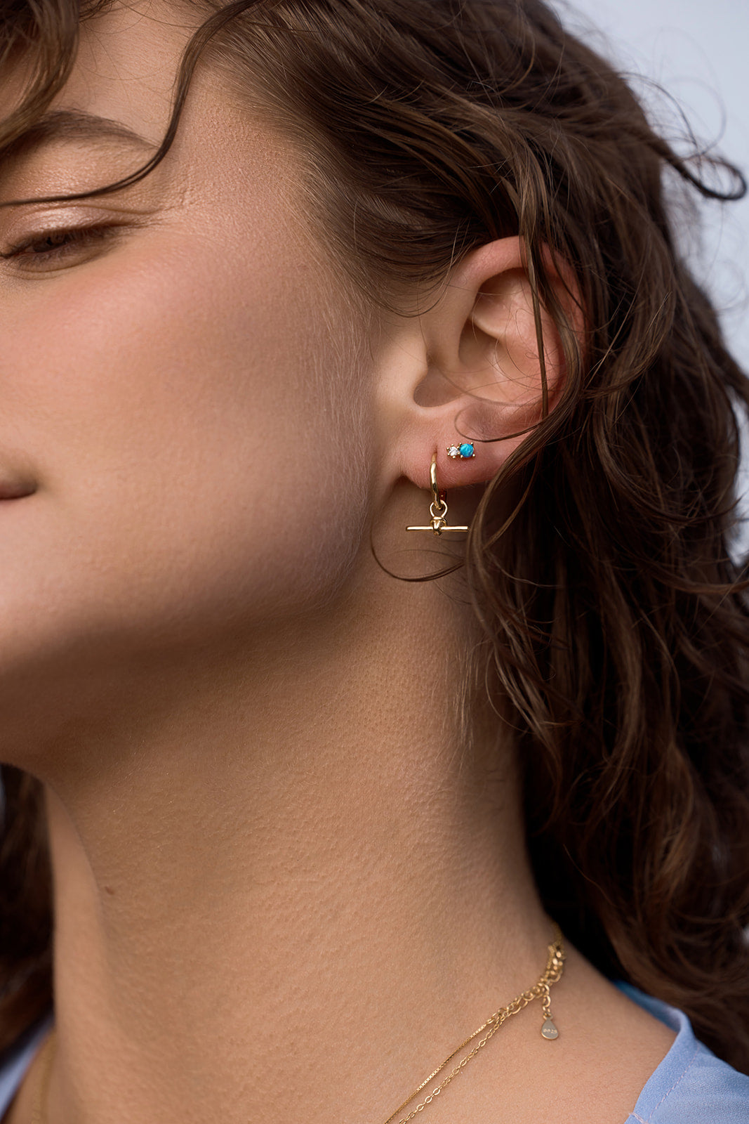 Milly Studs - Blue Opal close up of women earring