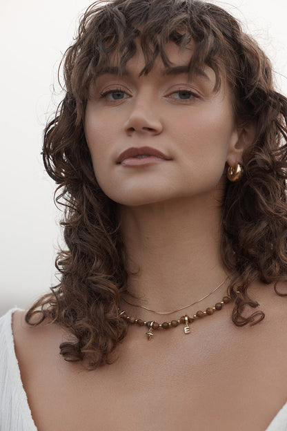 Mimi Hoops - Gold women wearing earrings 