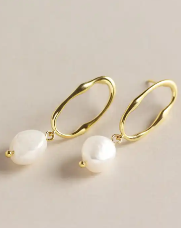 Nola Drop Pearl Earrings flat lay beige back ground