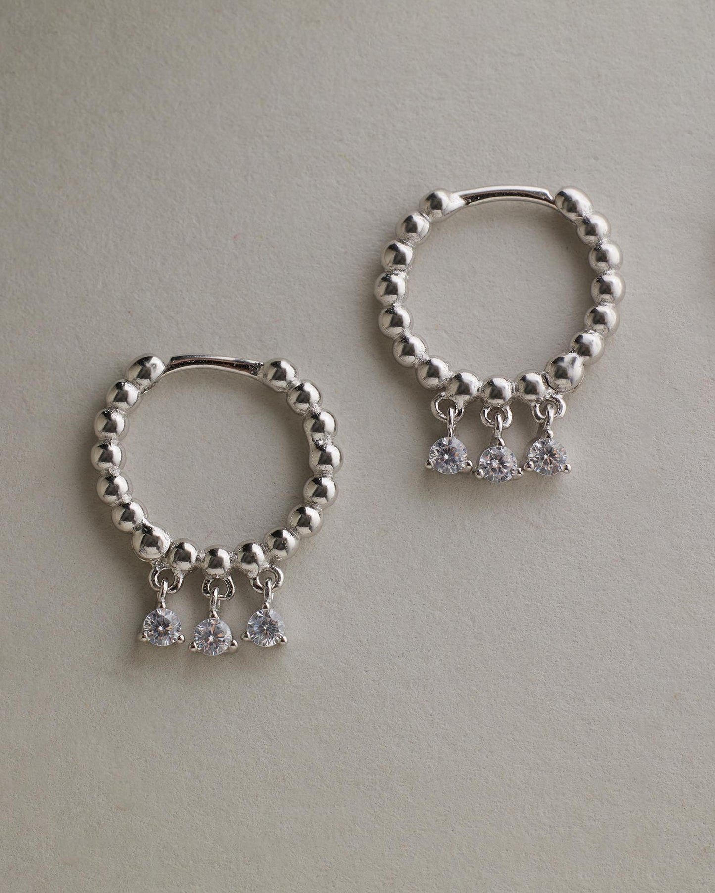 Sage Huggies - Silver flat lay