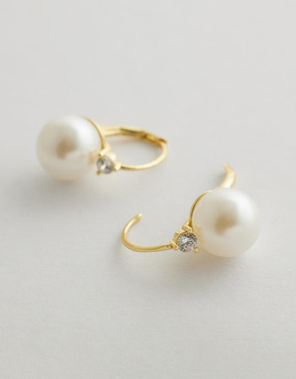 Valora Pearl Earrings side on flat lay