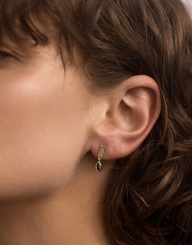 akira_emerald_drop_earrings on model ears