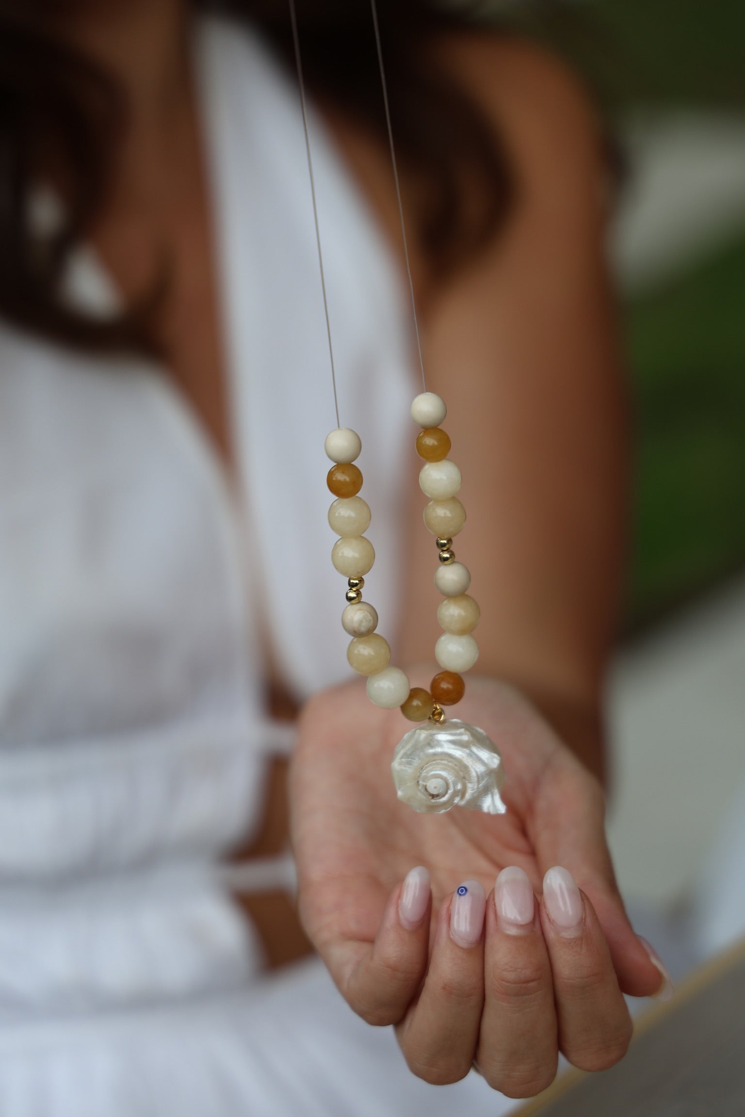 jewellery making workshop, womens showing what she is making
