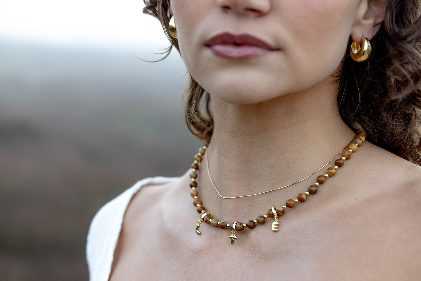 initial_necklace_tortoise_brown close up landscape