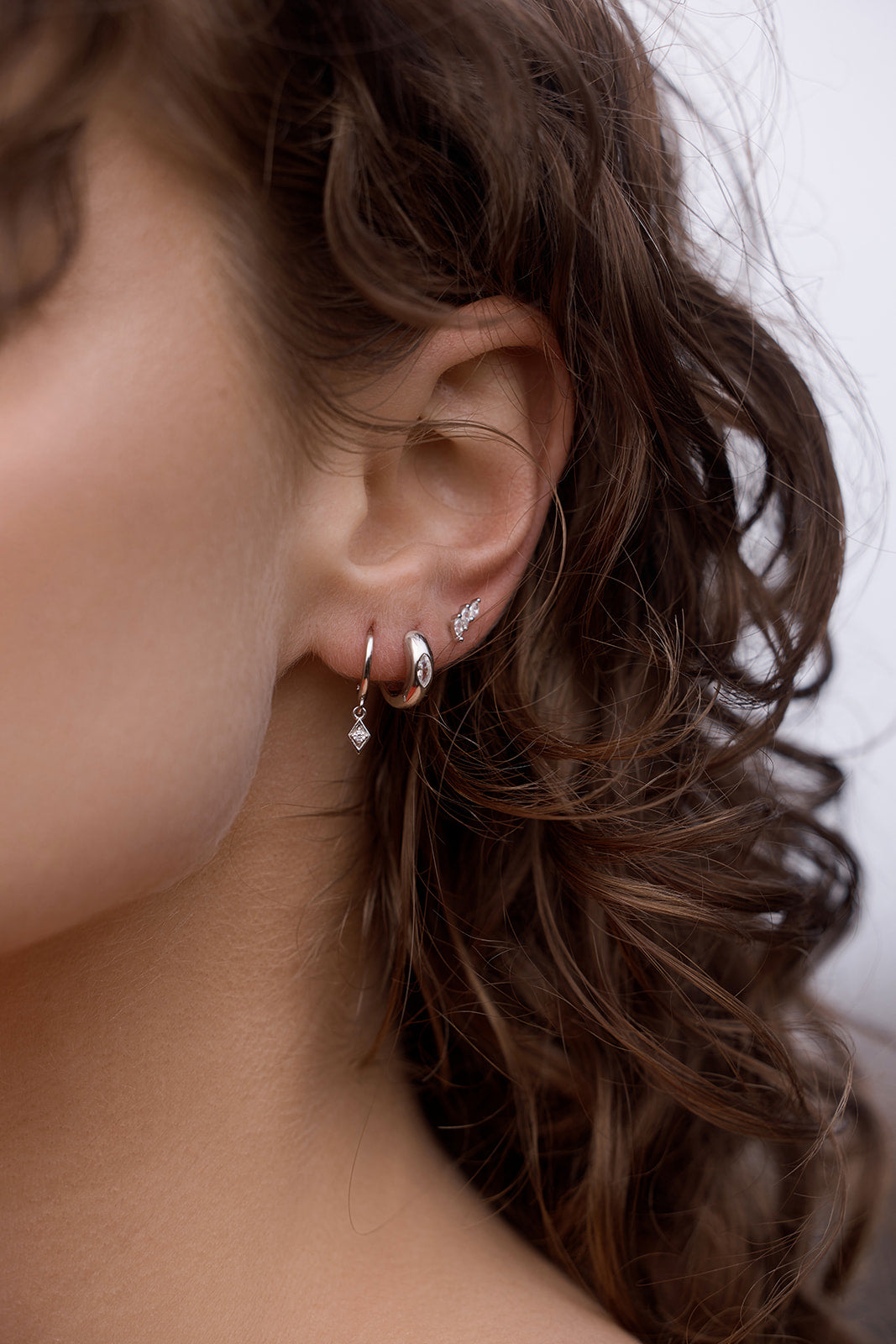 lunara hoop earrings silver on model styled earring stack