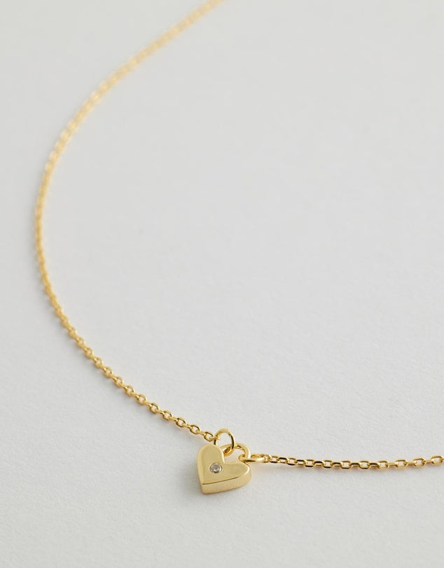 solstice heart necklace close up flay lay