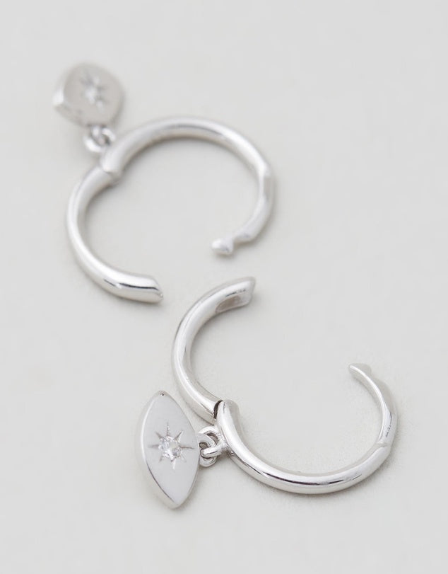 Evil Eye Huggies - Silver close up on grey back ground