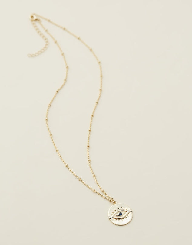 Evil Eye Necklace - Gold flat lay 