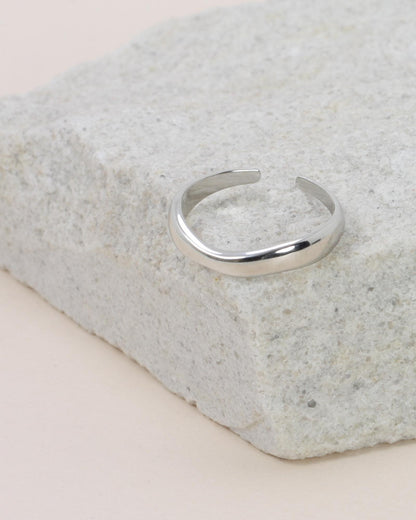 Hannah Wave Ring - Silver on a grey rock