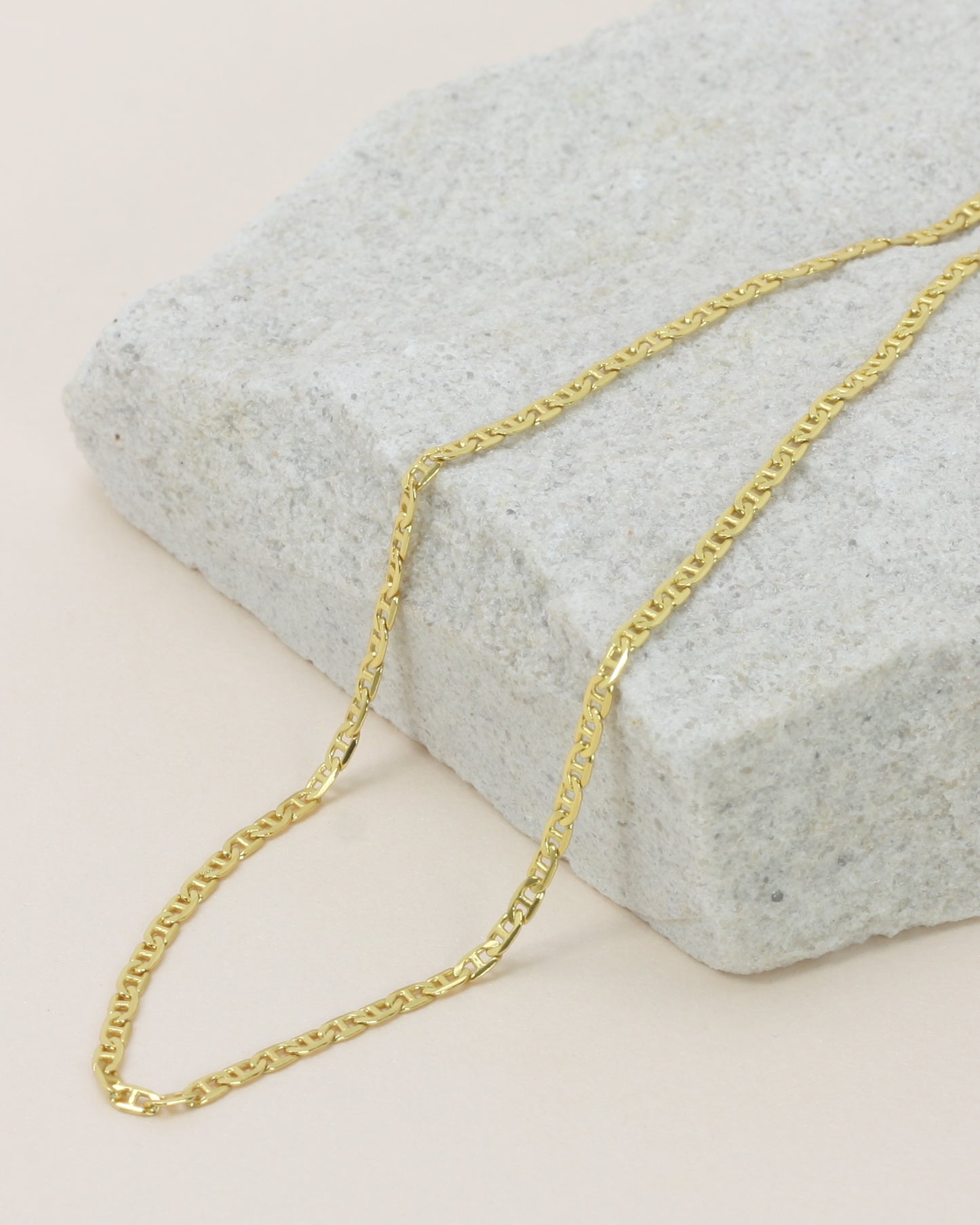 Hendrix Boyfriend Chain close up on a stone