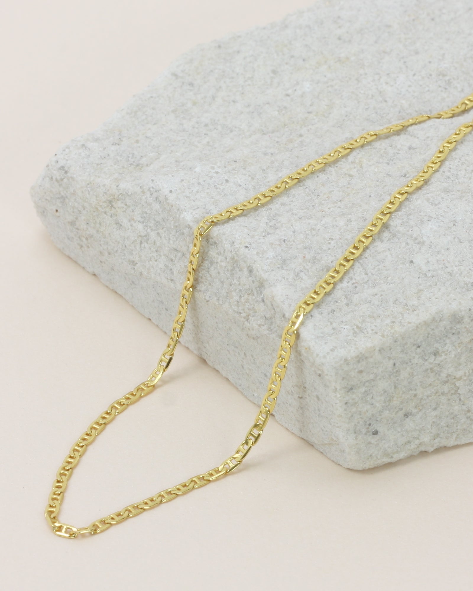 Hendrix Boyfriend Chain close up on a stone