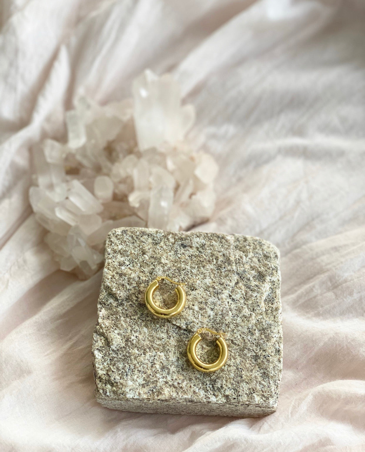 Indie Hoops - Gold earrings on a stone