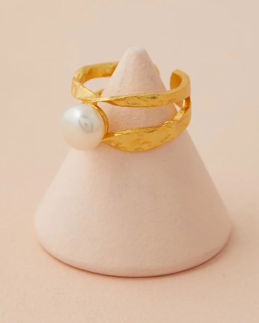 Isla Pearl Ring close up with pink back ground