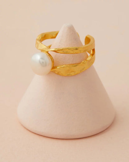 Isla Pearl Ring close up with pink back ground