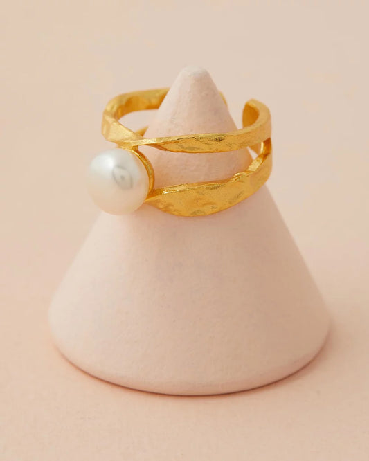 Isla Pearl Ring close up with pink back ground