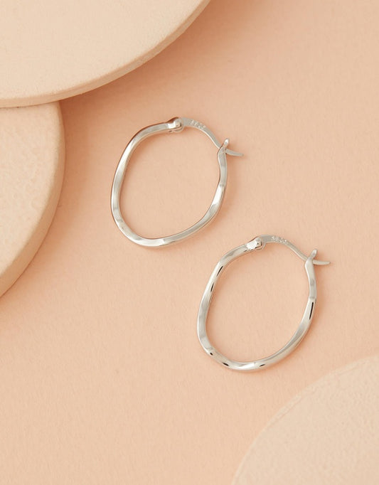 Lani Wave Hoops - Silver flat lay top view