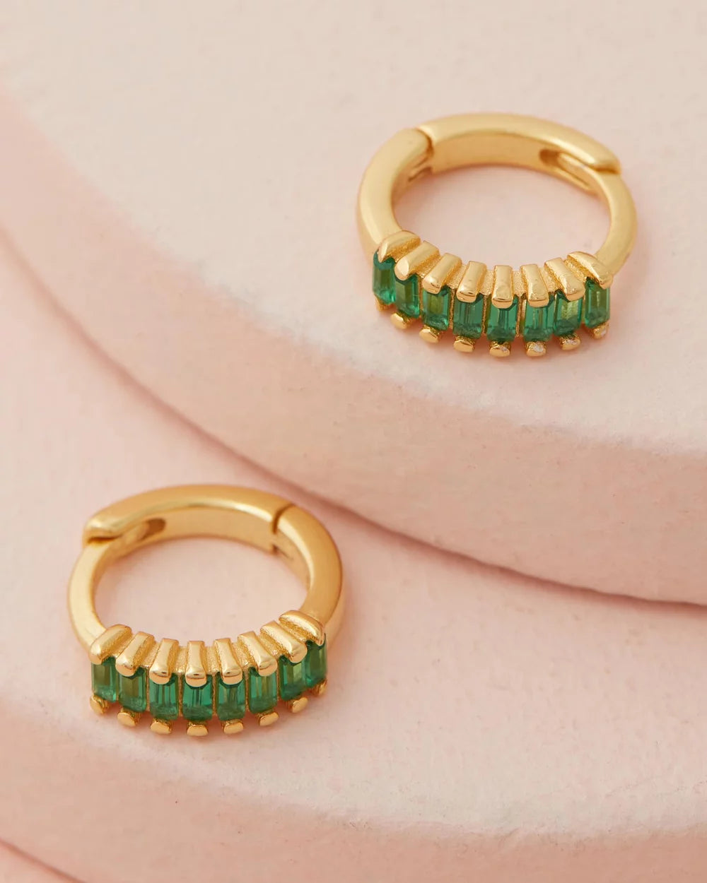 Lennox Huggies - Gold & Green flat lay on pink back ground