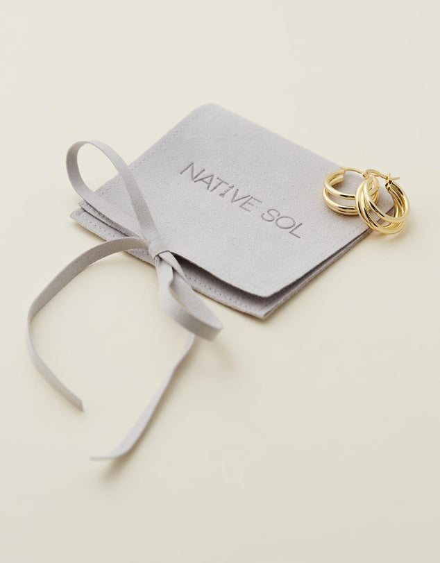 London Hoops - Gold flat lay on jewellery pouch