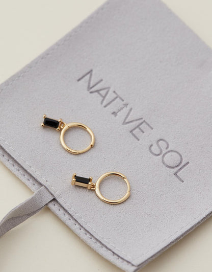 Rita Huggies - Black & Gold earrings on jewellery pouch