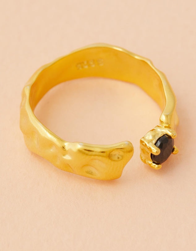 Rylee Onyx Ring flat lay on a light pink background